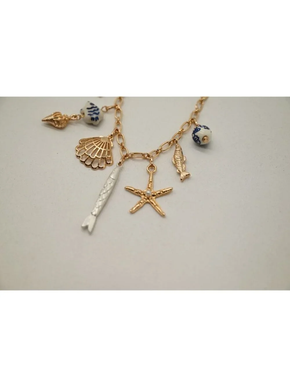 NWT Josslyn Gold Tone Charm Necklace Seashell Starfish Fish Pendant Coastal Boho